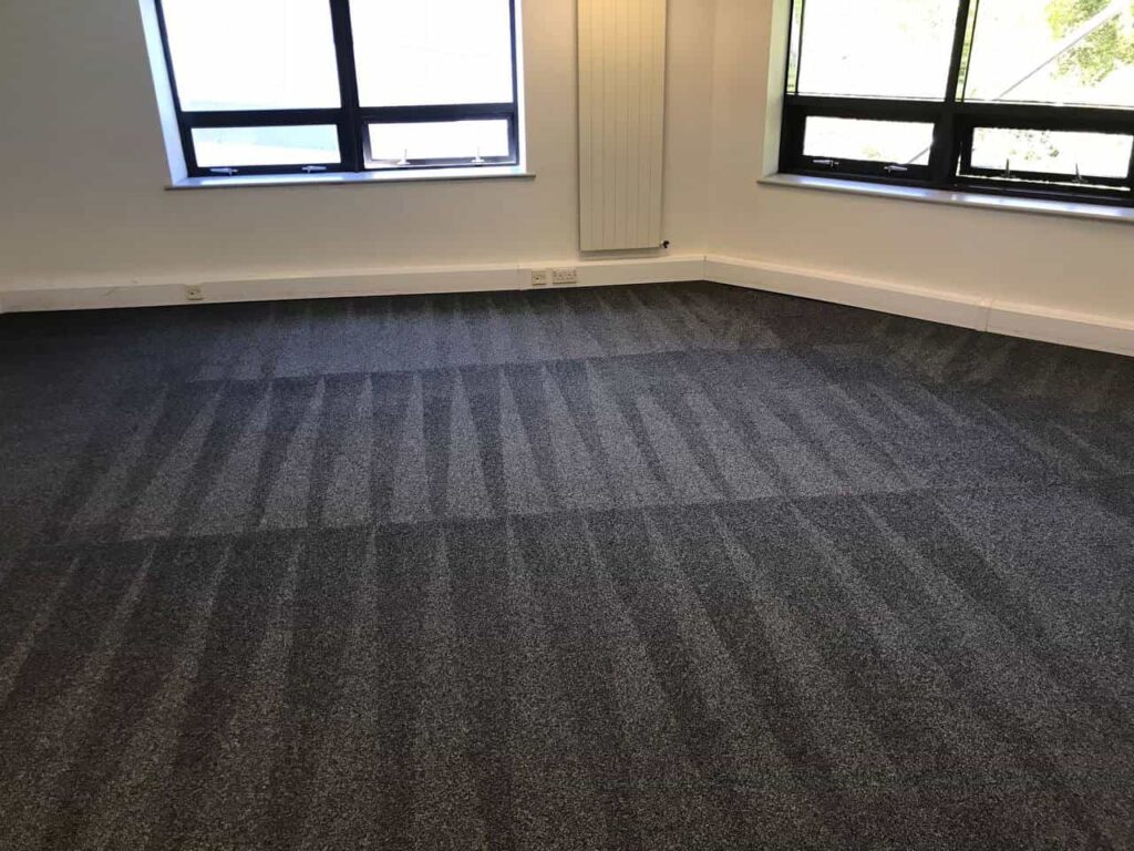 This is a photo of a grey office carpet that has just been professionally steam cleaned and carried out by Blackheath Carpet Cleaning.